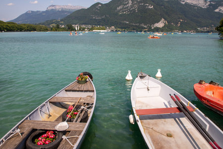 Boats on Annecy lake on a sunny day in Alps Franceの写真素材