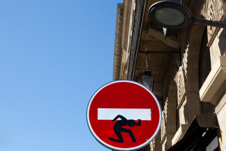 Bordeaux, France - 01 14 2024: Clet Abraham Street art road signs Wrong way street prohibited direction sign in the cityのeditorial素材