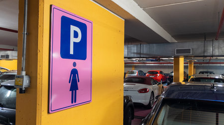 Milan , Italy - 01 25 2024: Lady parking sign text on pink panel background for women in the public car Park in girl priority conceptのeditorial素材