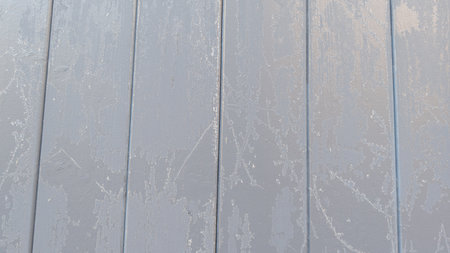 Wooden rustic gray background with snow ice freeze winter day