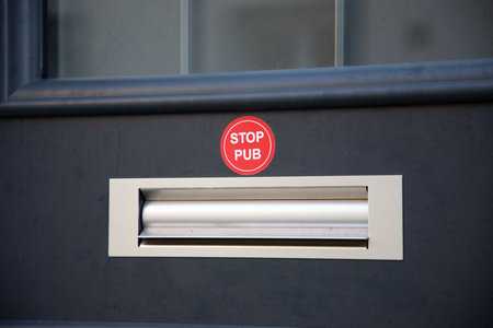 Mailbox with text sticker label written in French stop pub in concept of unsolicited advertising and...