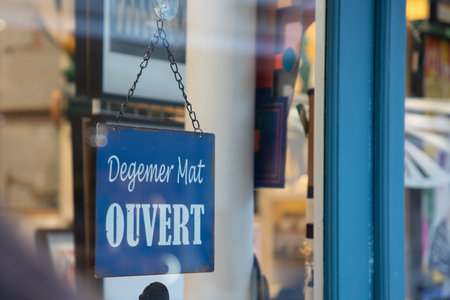 Degemer mat text means welcome in Breton and Ouvert French text means open on shop door entranceの写真素材