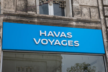 Angouleme , France -  04 08 2024 : Havas voyages text brand and blue sign logo front facade windows french office on holidays travel agencyのeditorial素材