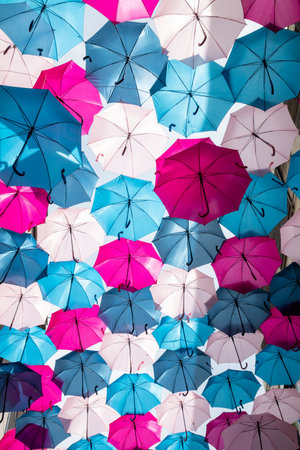 Colorful decorative umbrellas in the sky background in street decoration