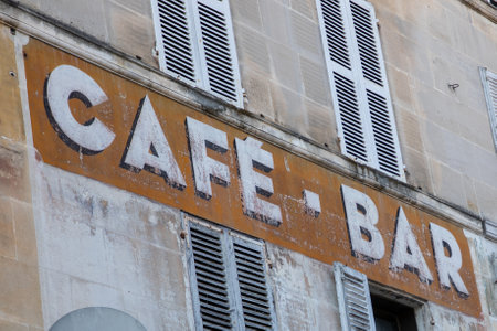 vintage bar cafe paint sign text on wall coffee ancient in city street storefront building entranceの写真素材