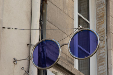 eyeglasses giant facade and text sign on shop of french shop optician glasses retailの写真素材