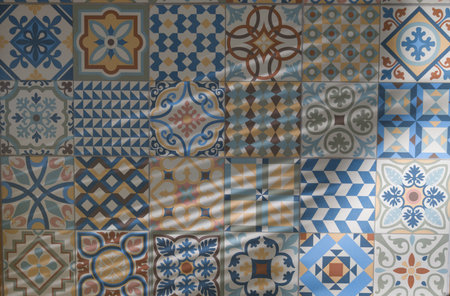 artistic cement tile mosaic tiles style seamless geometric patchwork south Azulejo wall decor with sun shadow backgroundの写真素材
