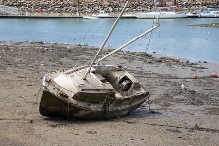 fishing boat on the beach in sea harbor low tideの写真素材