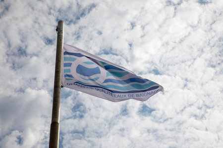 La Rochelle, France - 07 23 2024: Blue flag beach label demarche qualite eaux de baignade with...