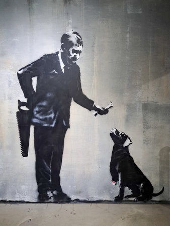 Bordeaux, France - 09 02 2024: Musee Banksy exhibition The World Of Banksy in Paris city with man...