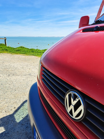 Bordeaux , France - 09 04 2024: volkswagen logo brand and text sign type 4 t4 bus red van parked in sea side coastのeditorial素材