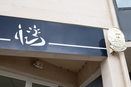 Bordeaux, France - 09 08 2024: Notary board facade french text sign on wall entrance agency notary buildingのeditorial素材
