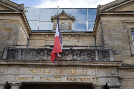 french city hall signage on stoned building facade entrance with text in french hotel de ville...