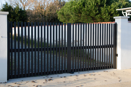 gray steel modern high gate dark aluminum portal of home door of suburbs house in street view