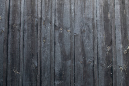 dark gray wood weathered fence background wooden gray plank linesの写真素材