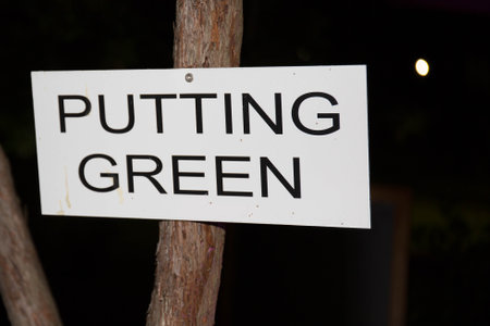 putting green sign text on wooden panel in golf areaの写真素材