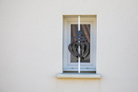 Vendee sign and logo of French department coat of arms badge on the metal protection of the window of a private house in Pays-de-la-Loire region in west France on the Atlantic Ocean coastの写真素材