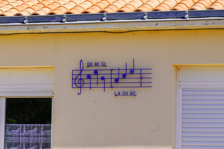 music score do mi si la do re sol on wall facade house entrance means home loveの写真素材