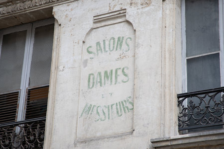 salons dames messieurs french text on sign wall facade ancientの写真素材