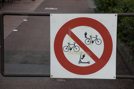 Forbidden to ride an electric scooter or bicycle ev no Parking allowed bicycles signの写真素材