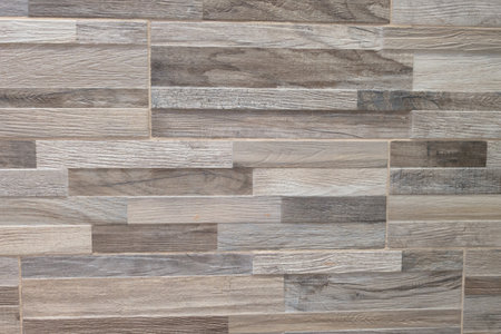 facade stones tiles wooden gray brown lines wall background of gray horizontal stone pattern...