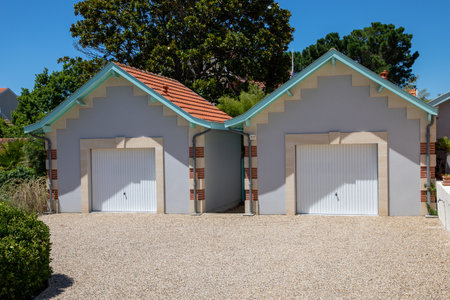 two portal garage door street flat access facade car door with closed gateの写真素材