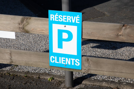 parking reserve client french text sign blue means private customer reserved parking car parked in city streetの写真素材