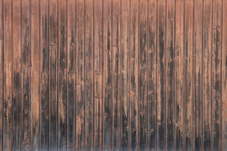 wallpaper weathered brown natural wall made of wooden nature vertical planks for background clear wood viewの写真素材