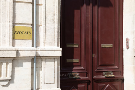 lawyer means lawyer text sign french on wall copper plate facade entrance doorbuilding counsel entrance solicitor in Franceの写真素材