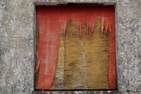old wooden door window with red paint textured canvas of wood featuring a blend of chipboard fiberboard particle board sheet plywood panel creating an abstract and natural backdropの写真素材