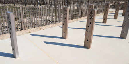 outdoor wooden bicycle parking with holes for bicycles locks bike rack stand with hole drilling for anti-theft deviceの写真素材