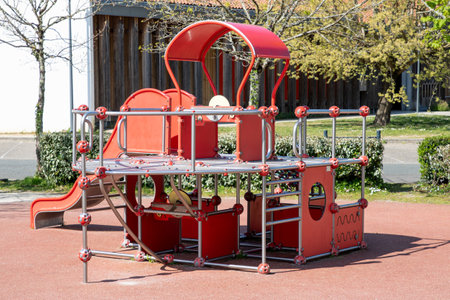 Children red steel slides playground kids play plastic area with bridge and cabin on city park