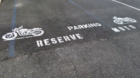 reserved motorcycle parking french text sign means parking reserve moto on street motorbike park traffic signal urban parking moto iconの写真素材
