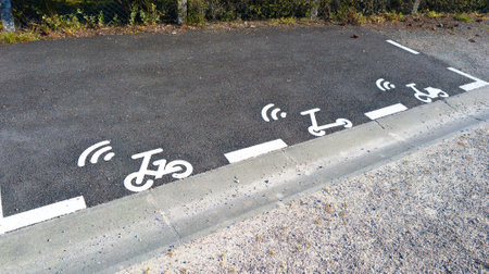park road sign panel for parking reserved for bicycles scooters electric scooters in self-service parking city area sign floorの写真素材