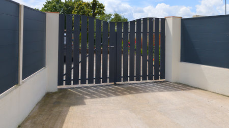 suburb home gray dark metal aluminum plank house gate slats garden access door