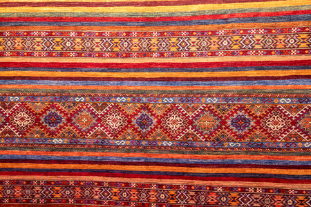 background textile vibrant pattern featuring colorful stripes and geometric designs craftsmanship and cultural significanceの写真素材
