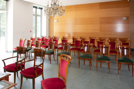 wedding city hall spacious town hall with natural light and empty chairs ready for marriage eventの写真素材