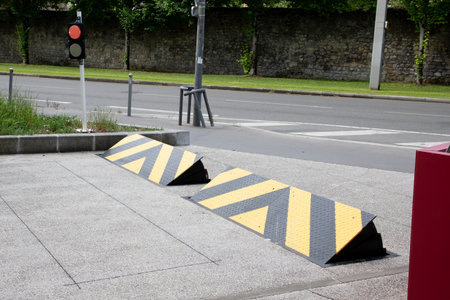 Two reasonable road blockers vehicle enter black yellow for preventing of cars access areaの写真素材