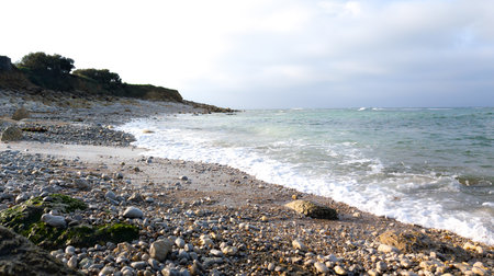 waves breaking in low tide on the french atlantic coastの写真素材