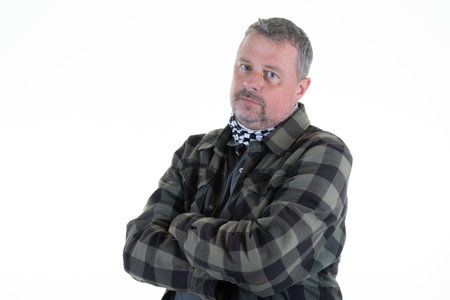 portrait handsome fourty man sad fashion guy with confident face with beard green plaid shirt in serious expression on white backgroundの写真素材