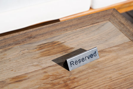 reserved table sign text on wooden table restaurant copy space word on wooden backgroundの写真素材