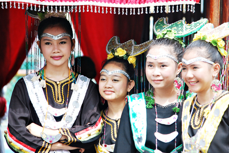 Sipitang, Sabah Malaysia.August 30, 2014 : A group of Bisaya young girls in their traditional costume standing at their booth enterance during the GaTa festival in Sipitang Sabah Malaysia.のeditorial素材