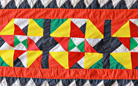 The Linangkit patern: Emboidery of the Dusun Lotud. Pieces of cloth sewn together in triangle...