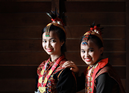 Kota Kinabalu, Sabah Malaysia.May 31, 2015 : Dusun Lotud girls in colorful traditional costume during Pesta Kaamatan or Harvest Festival in Sabah Borneo. Image contains shadow from natural lights.のeditorial素材