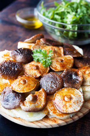 Potatoes and shiitake mushrooms in the style of octopus a feira. typical Galician dish. Vegan adaptation of the octopus to Galician feira. Food photographyの写真素材