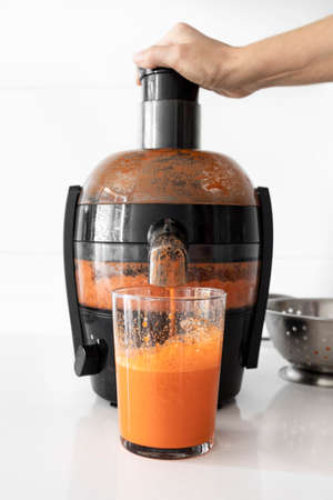 Homemade carrot juice made with a blender. Blender making juiceの写真素材