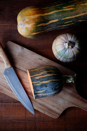 Pumpkin is a healthy fall food. Cooking pumpkin. Recipes with pumpkin. Food photo with dark backgroundの写真素材