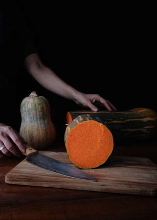 Pumpkin is a healthy fall food. Cooking pumpkin. Recipes with pumpkin. Food photo with dark backgroundの写真素材