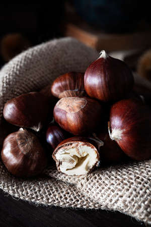 Still life of chestnuts with dark backgroundの写真素材