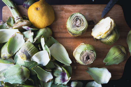 Cleaning and preparing artichokes in the kitchen. Cooking artichokes. Homemade healthy foodの写真素材
